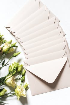Envelopes with bouquet of delicate flowers